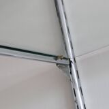 Chrome and glass wall shelf, circa 1960