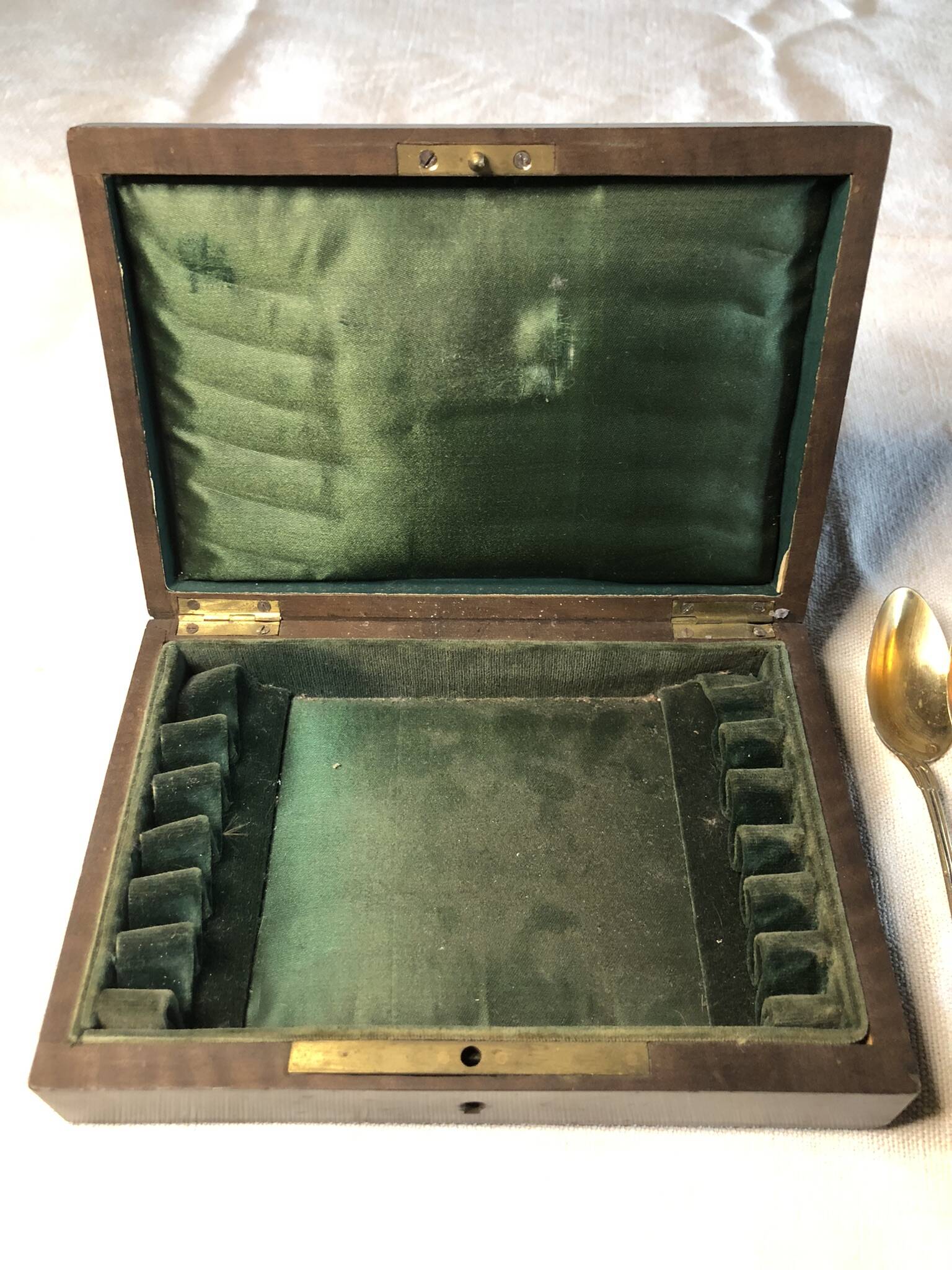 Vermeil (gilded silver) spoons in black wooden box