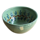 Large glazed ceramic salad bowl with a floral design.