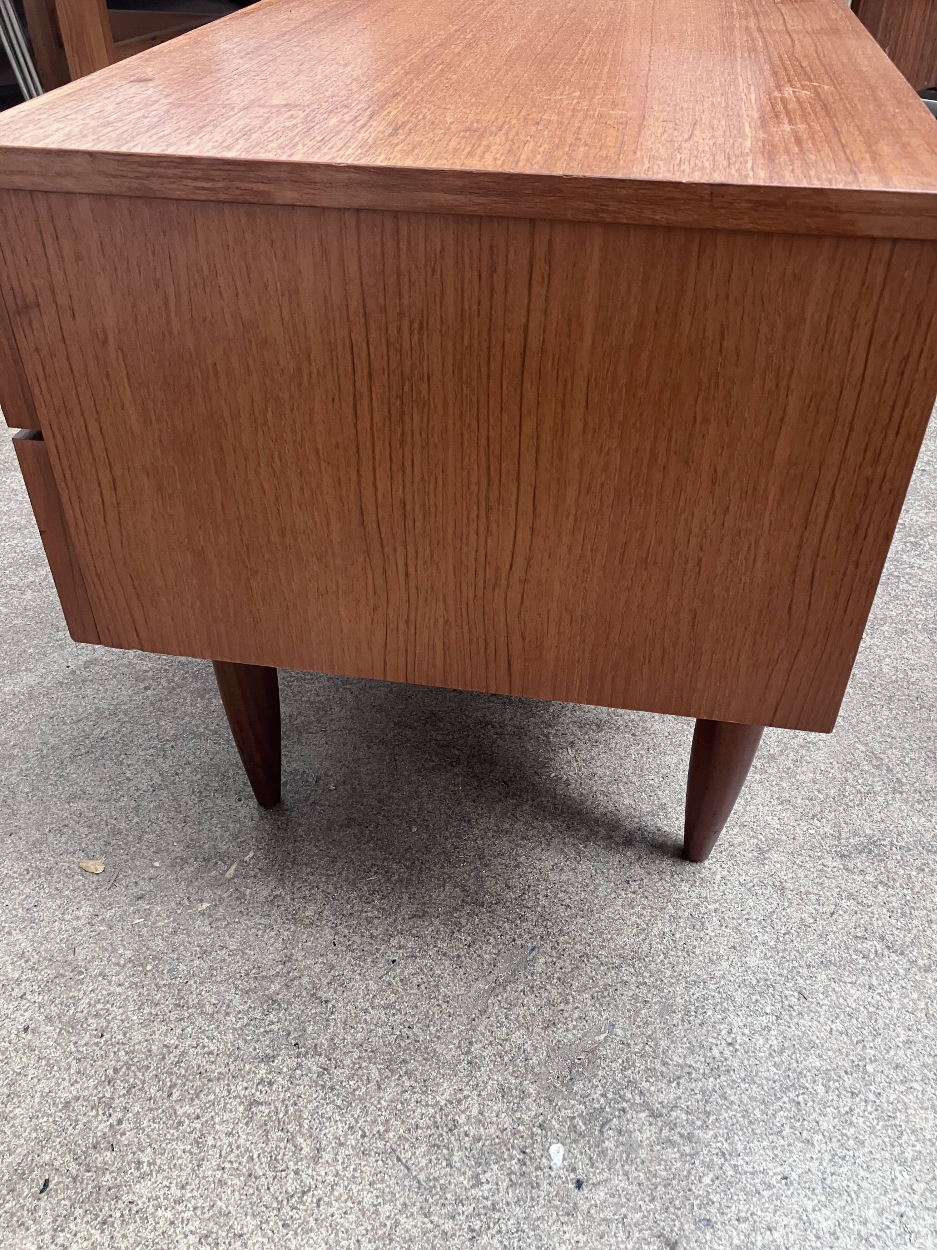 Teak sideboard with flap, 2 drawers and conical legs.