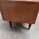 Teak sideboard with flap, 2 drawers and conical legs.