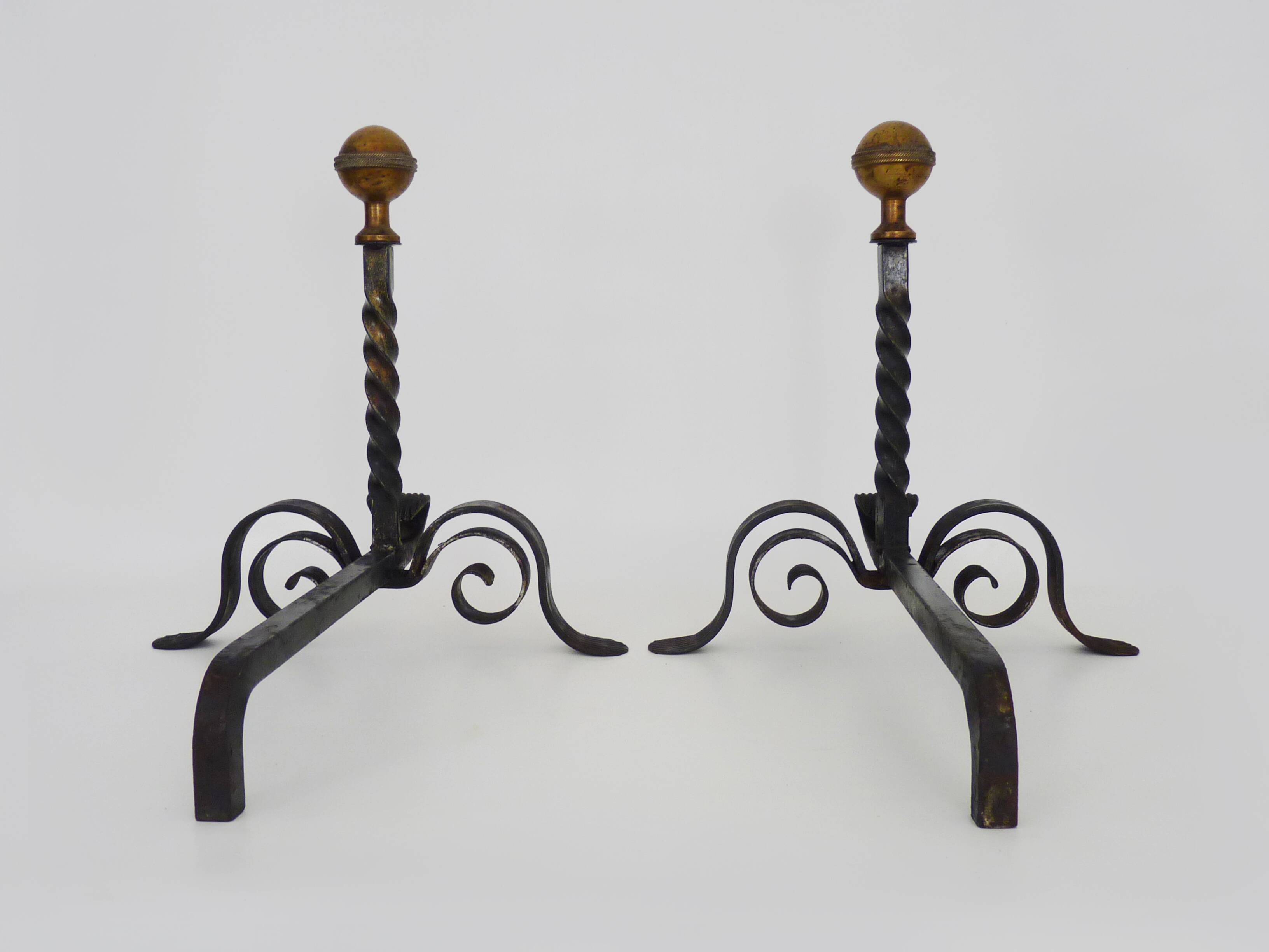 Large pair of wrought iron and brass ball fireplace andirons. 19th century
