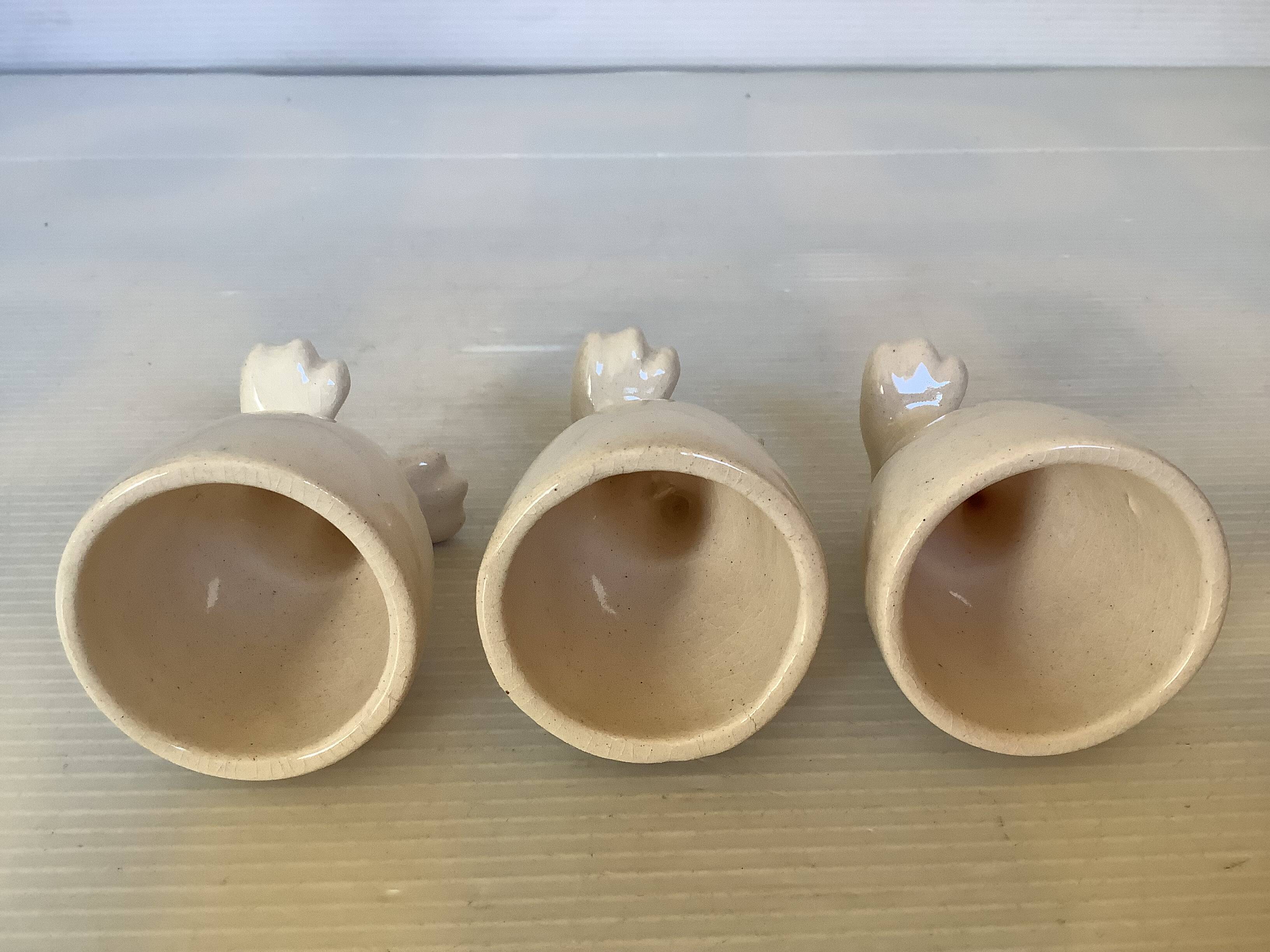 Set of cracked egg cups with feet