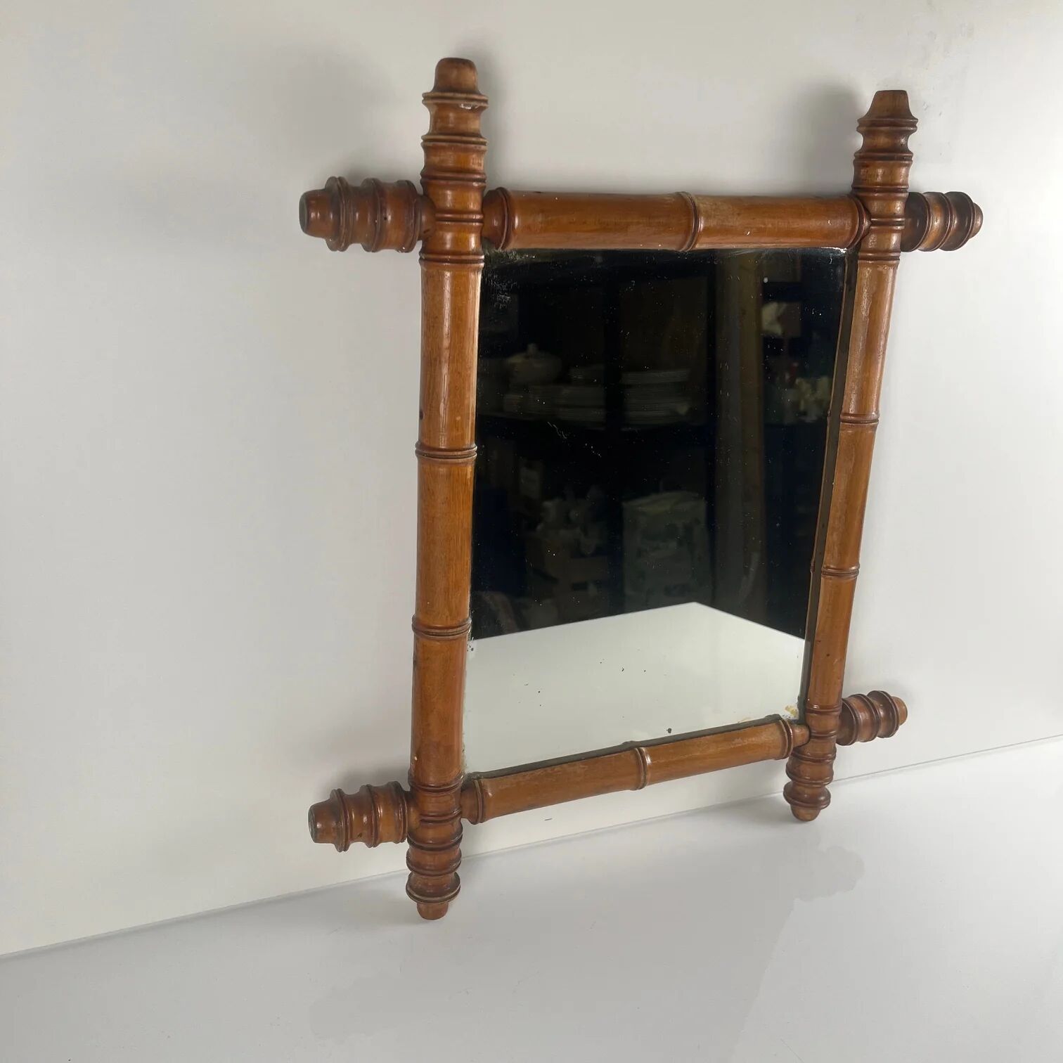 Wooden turned mirror in bamboo style, circa 1900-1930.