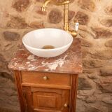 Washbasin made from a bedside table.