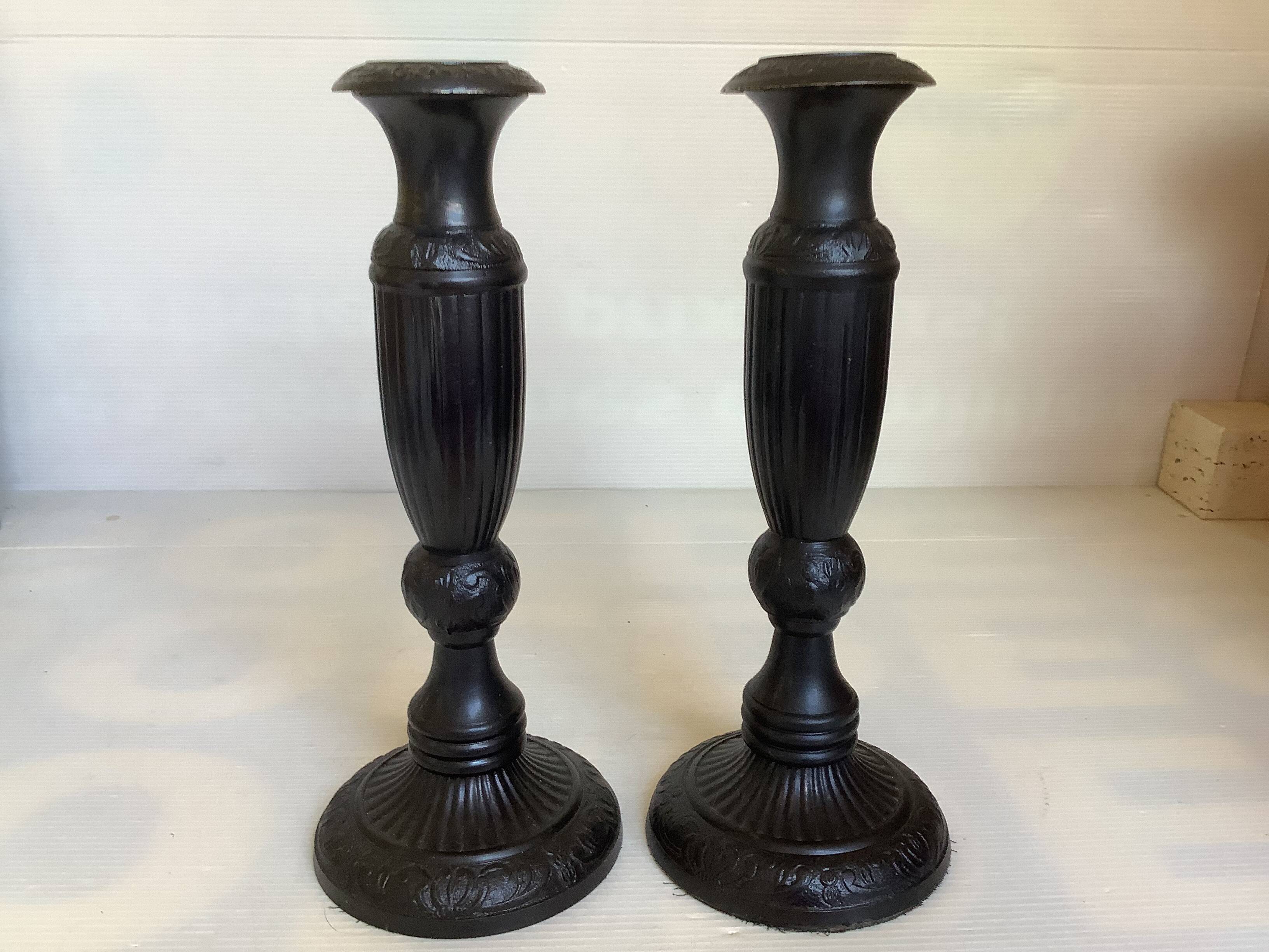 Pair of large black metal candlesticks