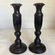 Pair of large black metal candlesticks
