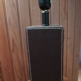 Tall cubic brown leather lamp, light gray fabric lampshade