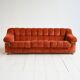 Vintage rust velvet sofa from the 1970s with metal details.