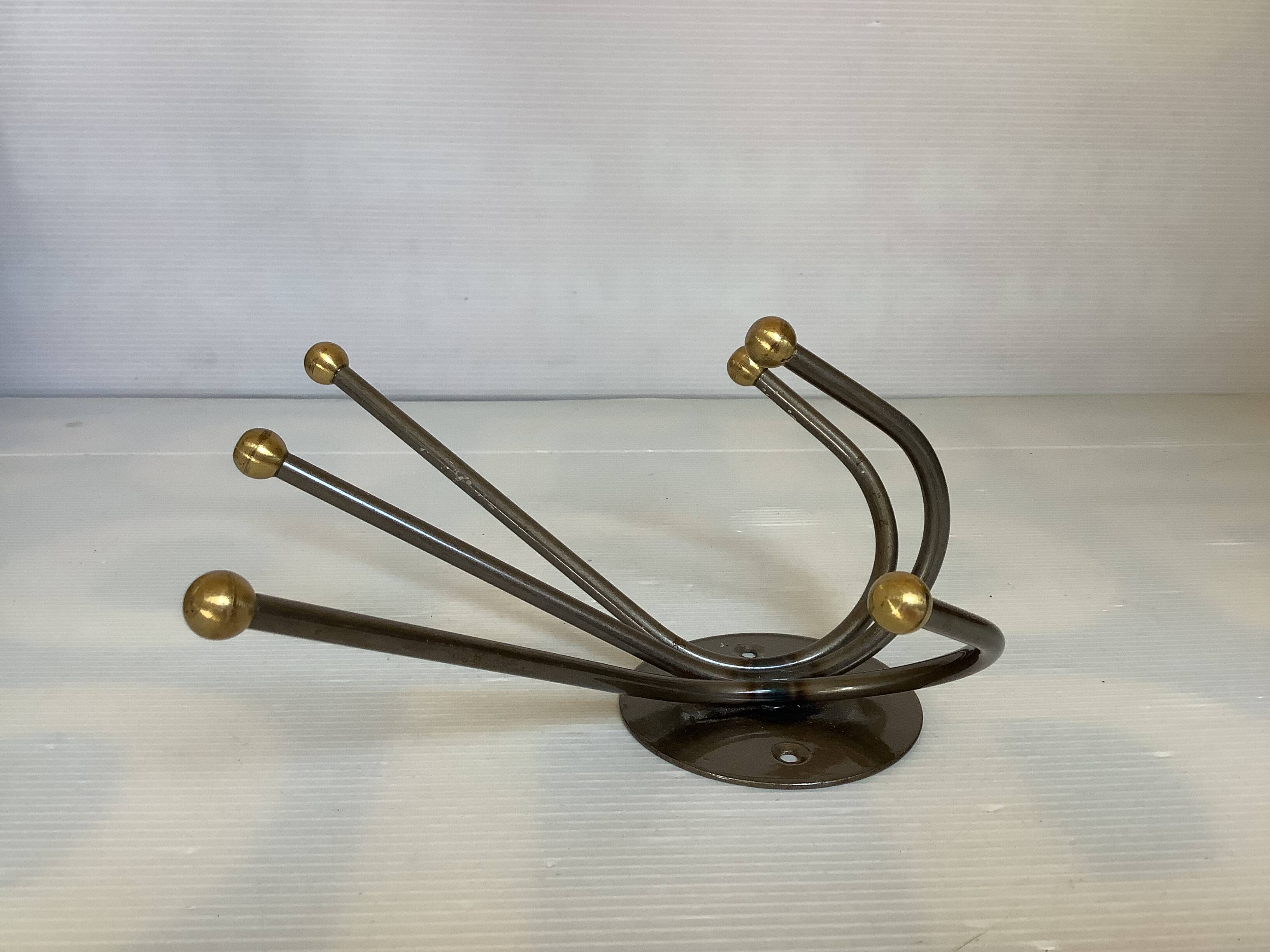 Small metal coat rack with six hooks