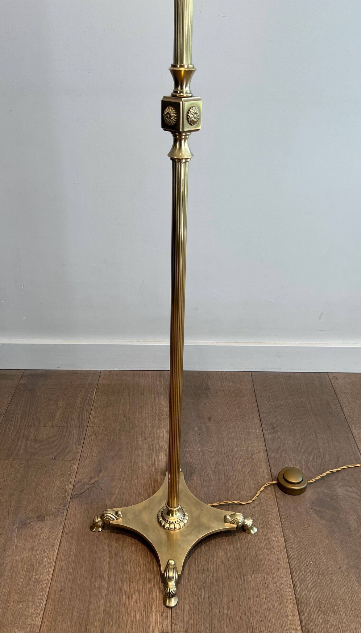 Neoclassical brass floor lamp with claw feet from Maison Jansen.