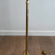 Neoclassical brass floor lamp with claw feet from Maison Jansen.