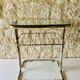 Glass and brass side table with magazine rack, circa 1970's
