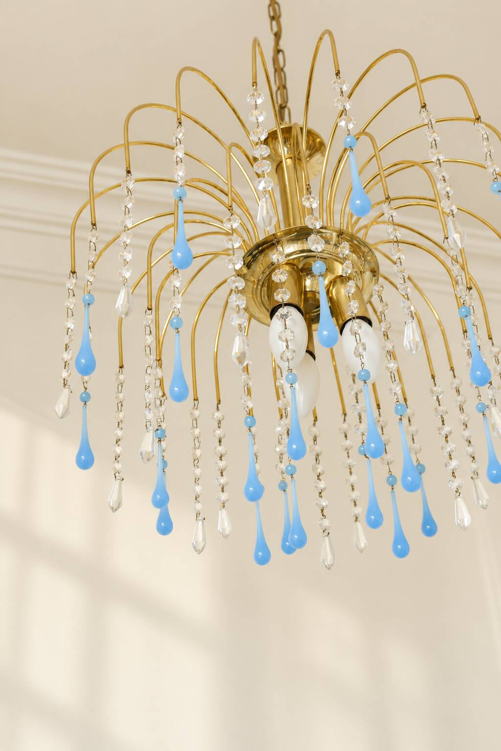 Vintage chandelier with blue Murano glass pendants.