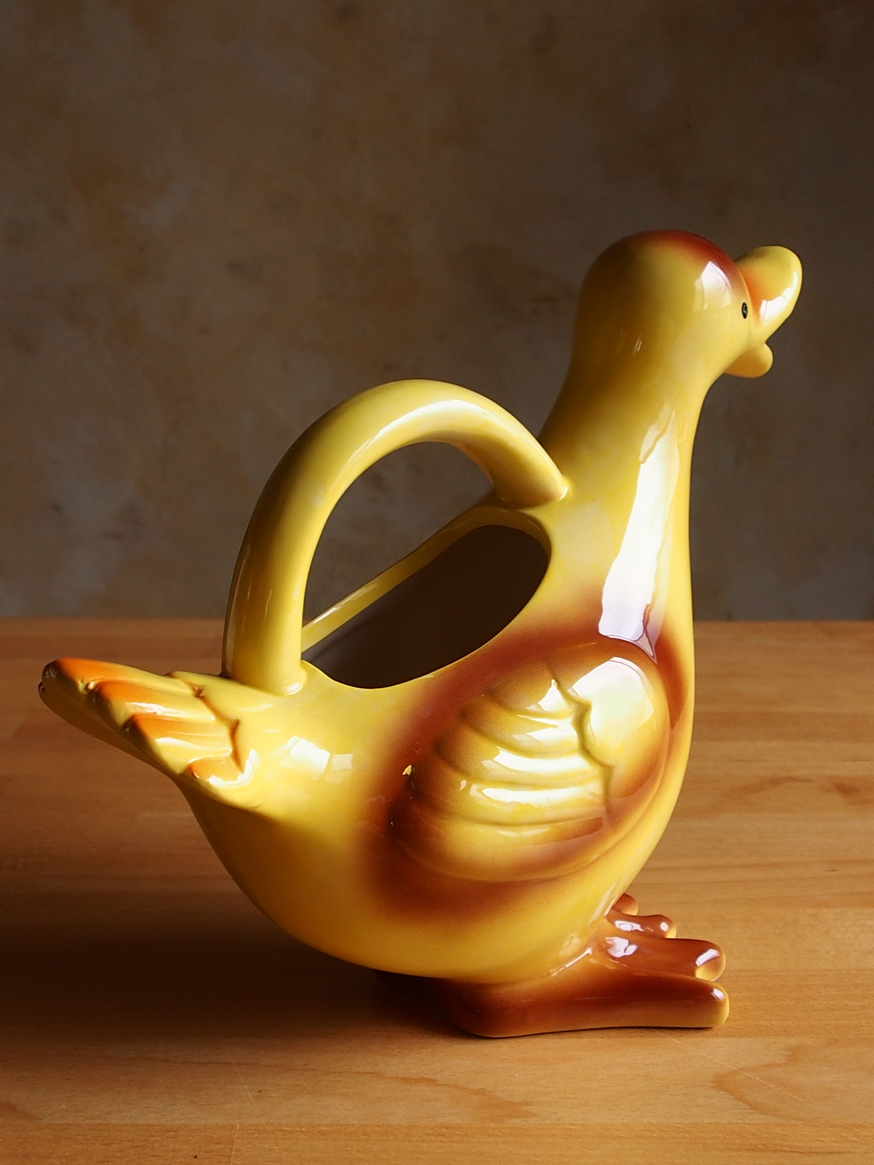 Ceramic watering can in white earthenware, yellow enamel and bird shape
