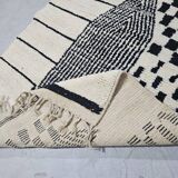 Handmade pure wool rug in black and white, size 150 x 250 cm.