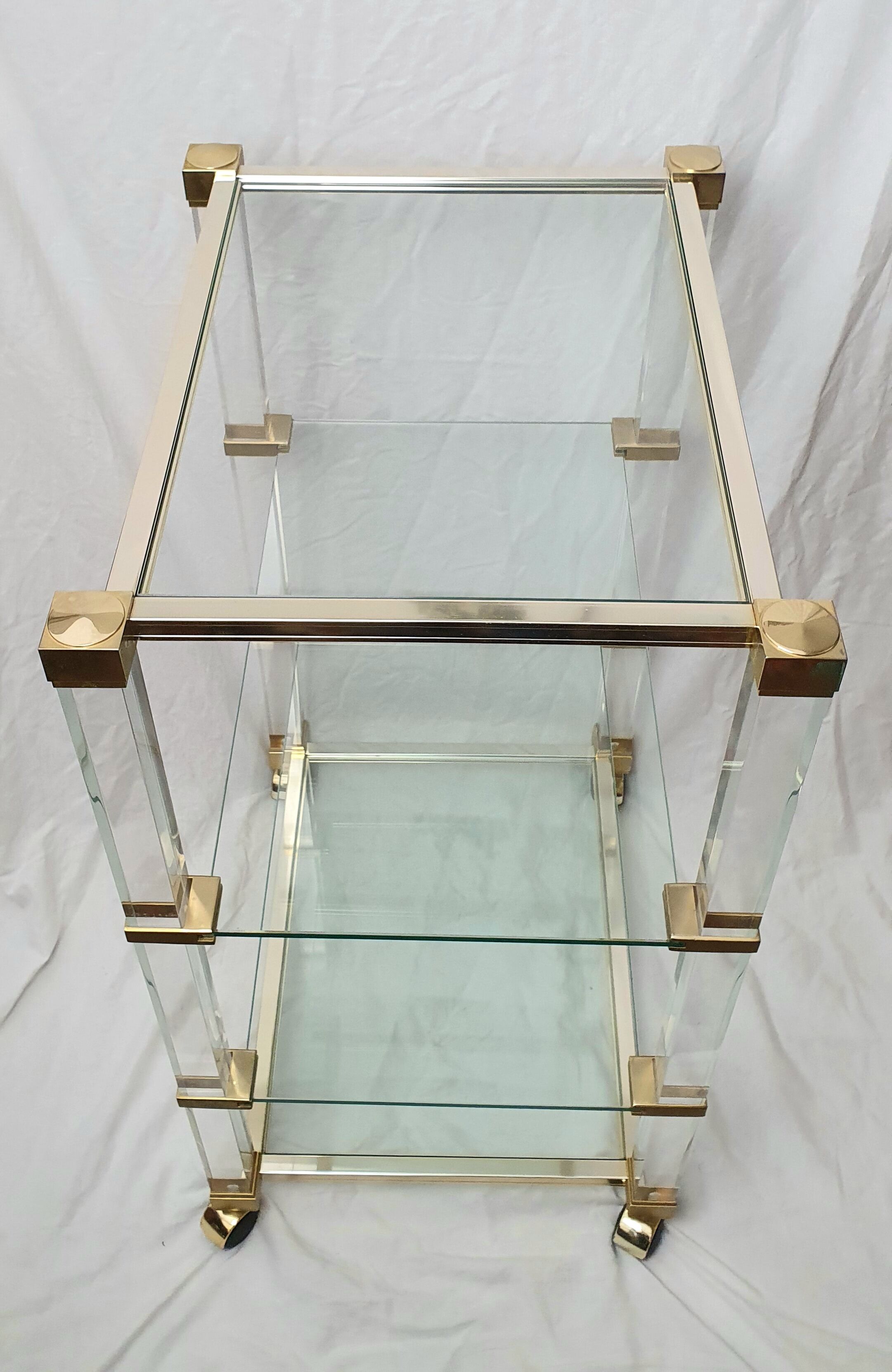 Rolling glass and plexiglass shelf by Pierre Vandel