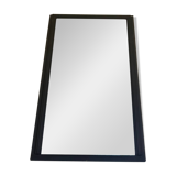 Old mirror with black powdered frame