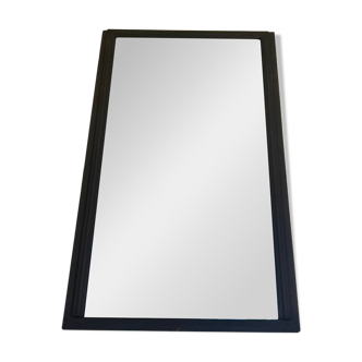 Old mirror with black powdered frame