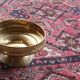 Fruit bowl, basket on foot, compote dish in embossed brass.