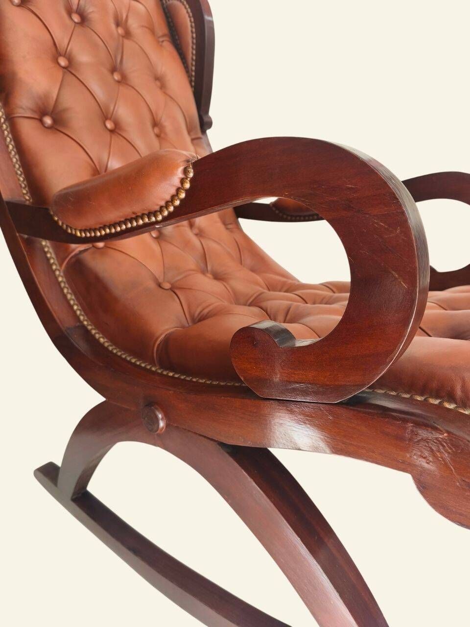 Rocking chair with footrest, wood and tufted leather
