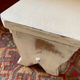 Patinated wooden footrest.