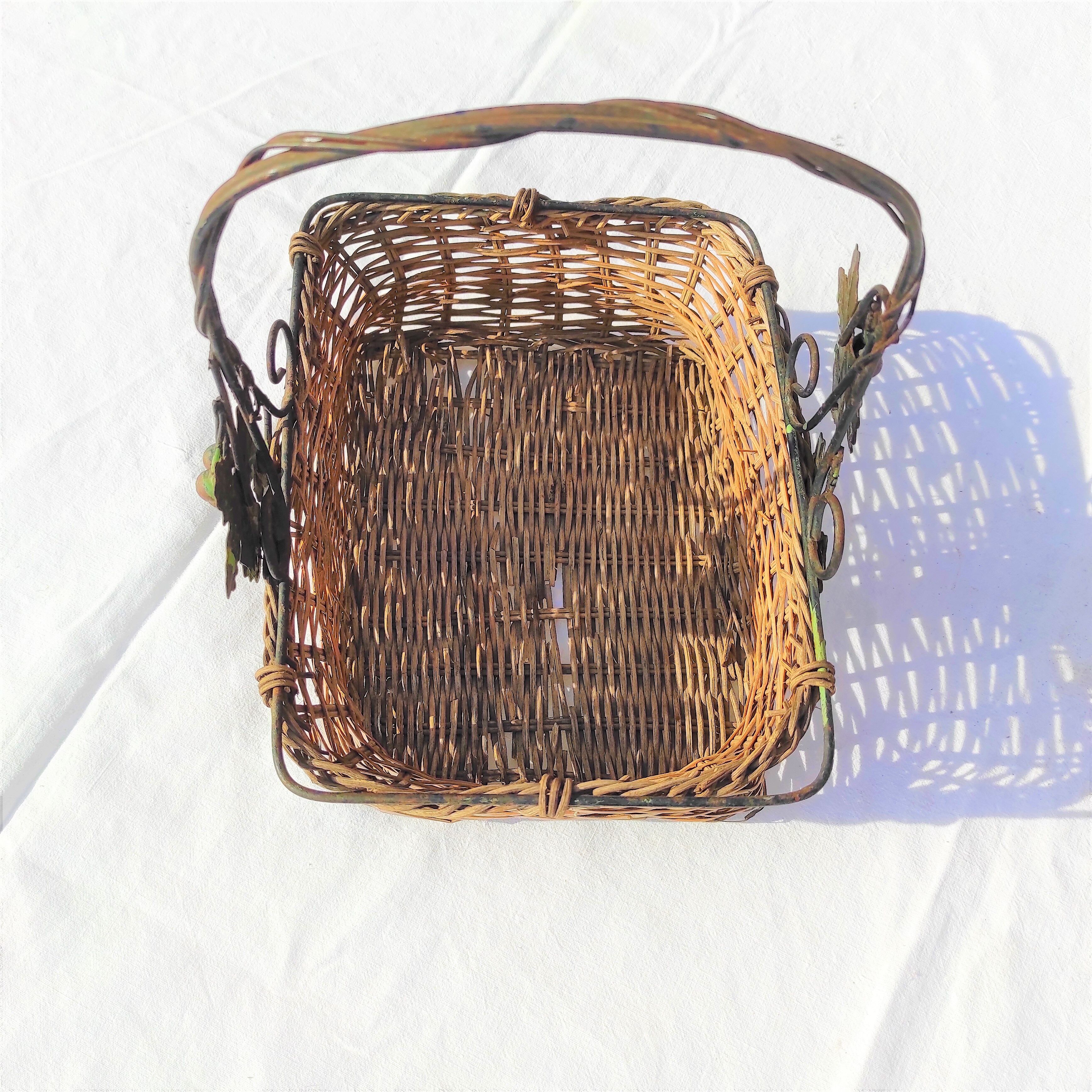 Old wicker basket decoration vine leaves and grapes