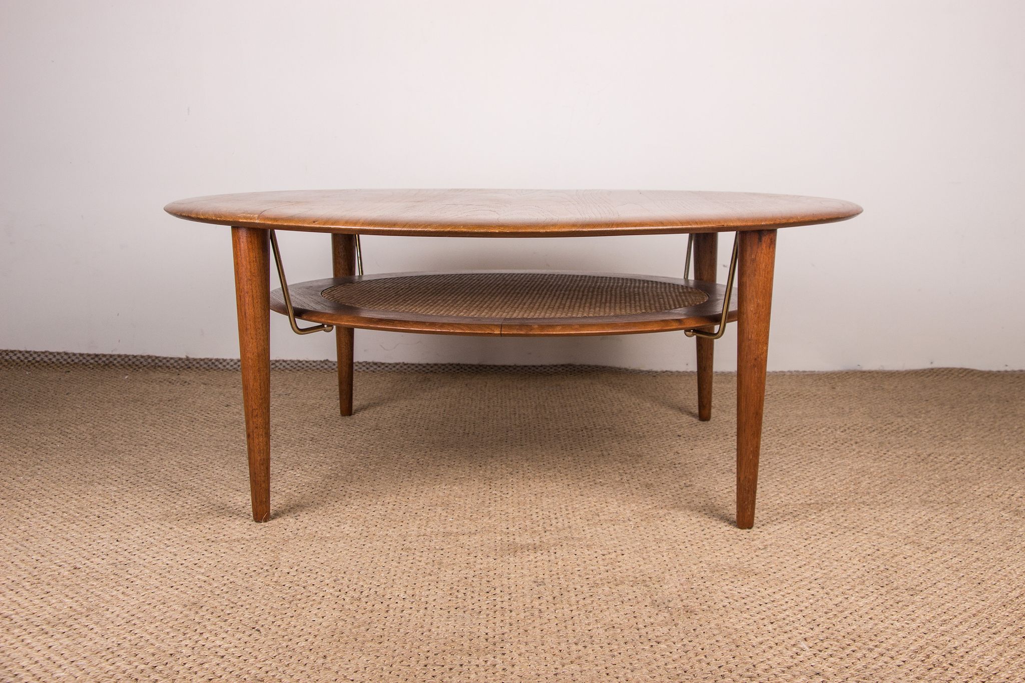 Round coffee table, two levels, danish in teak, brass and cannage