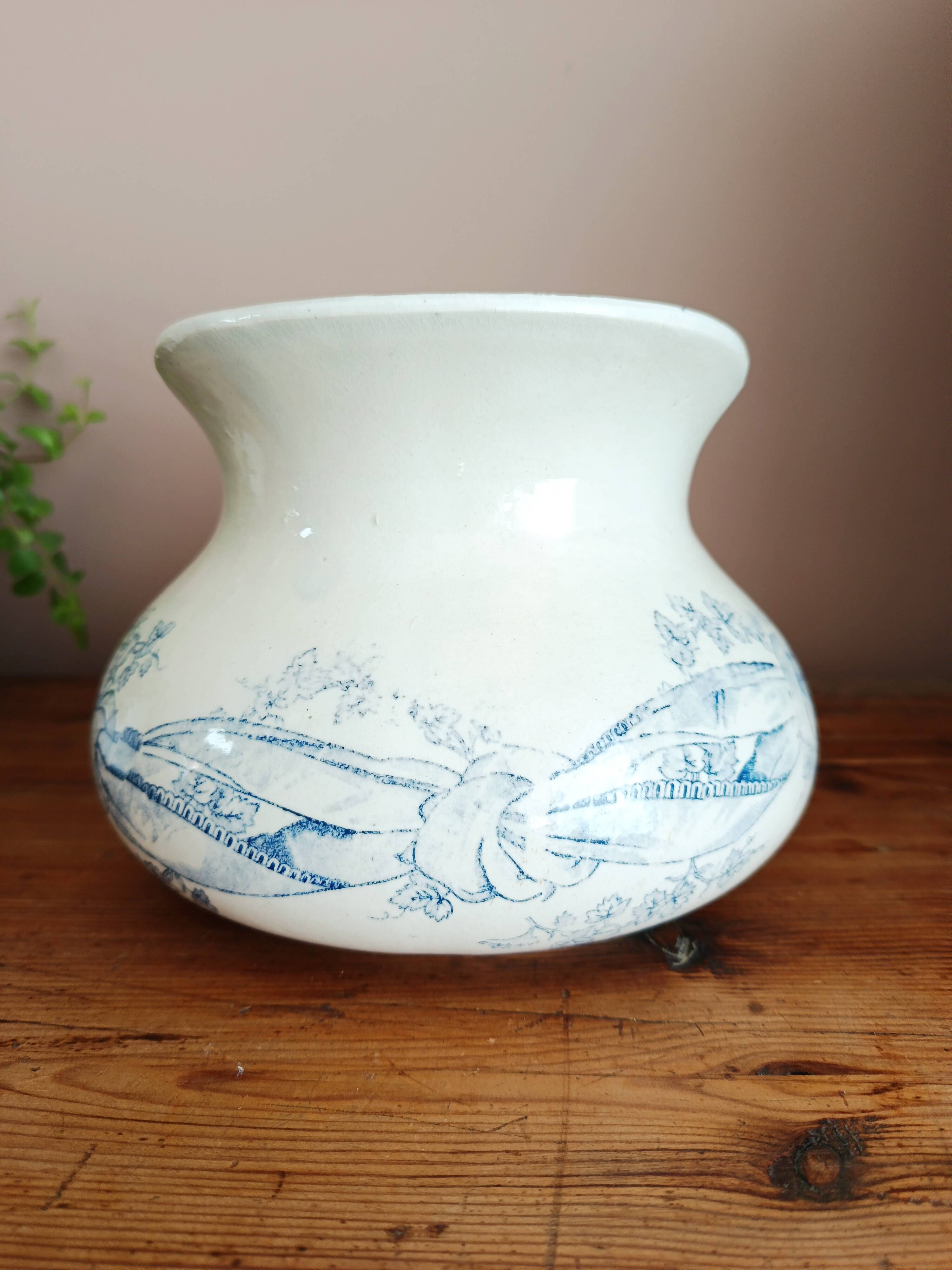Old bulbous jug in ironstone earthenware
