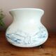Old bulbous jug in ironstone earthenware