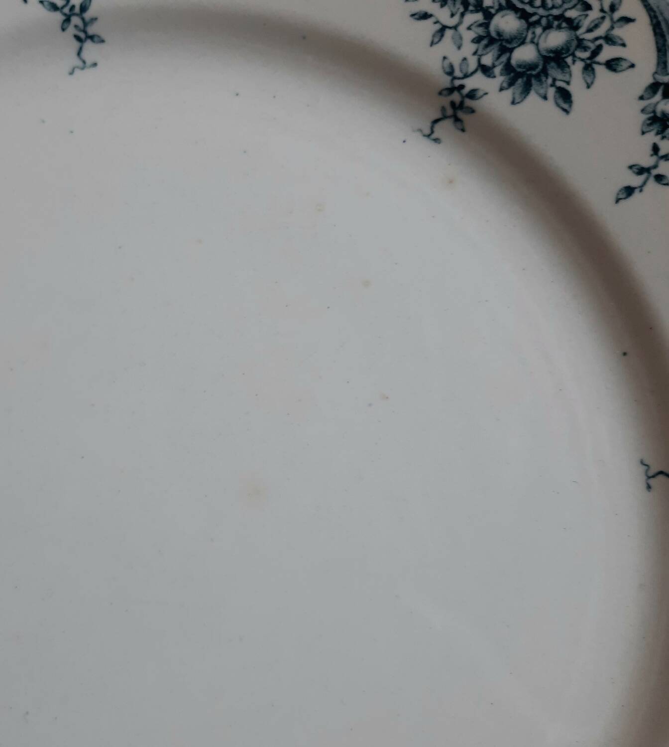 Old mismatched iron earthenware dessert plates accompanied by a dish