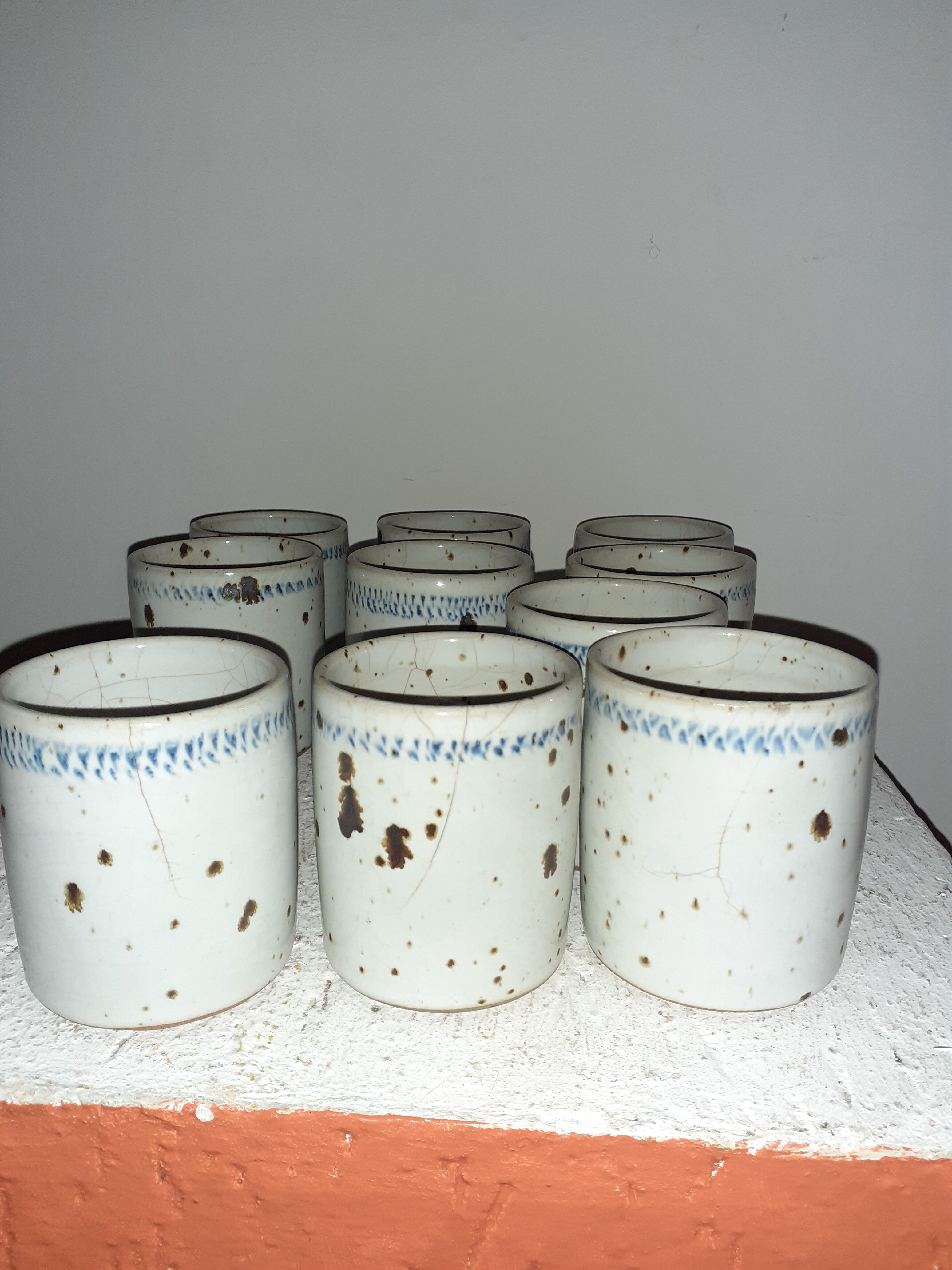 10 cups in enamelled pyrity stoneware