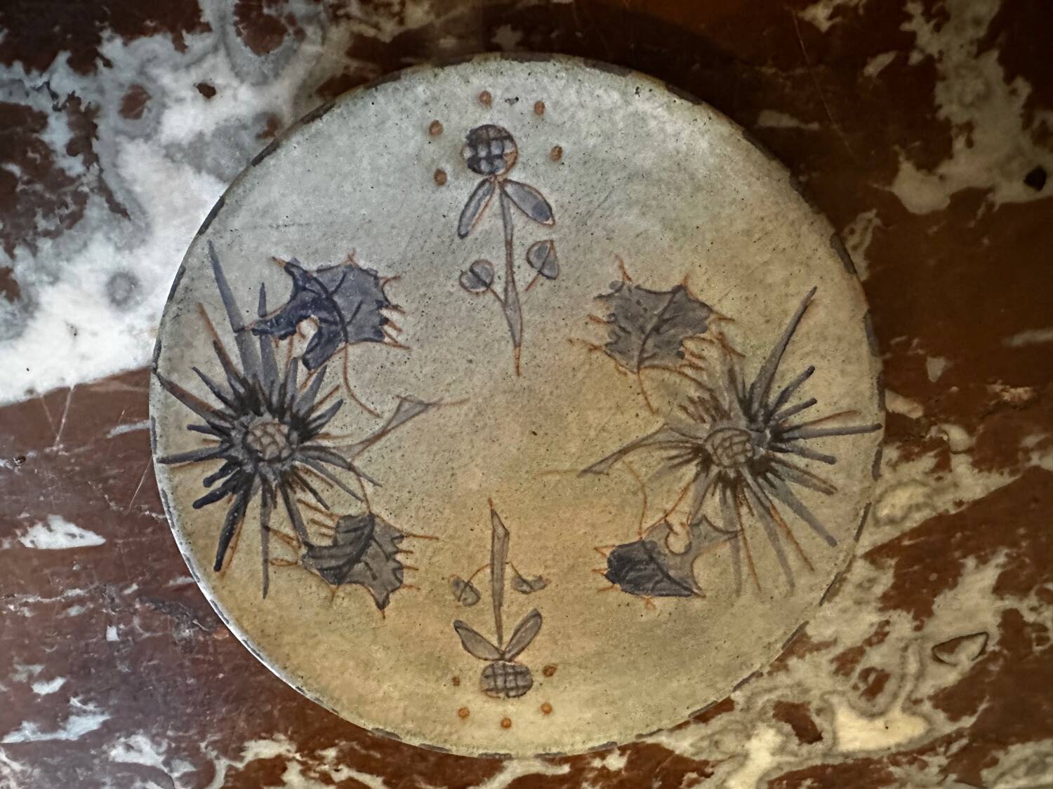 Ceramic plate signed by Marie-Madeleine Jolly – thistle decoration – year