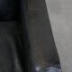 Armchair in black grained cowhide leather with a deep seat