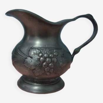 Pewter pitcher decorated with bunches of grapes