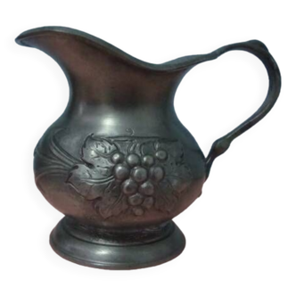 Pewter pitcher decorated with bunches of grapes