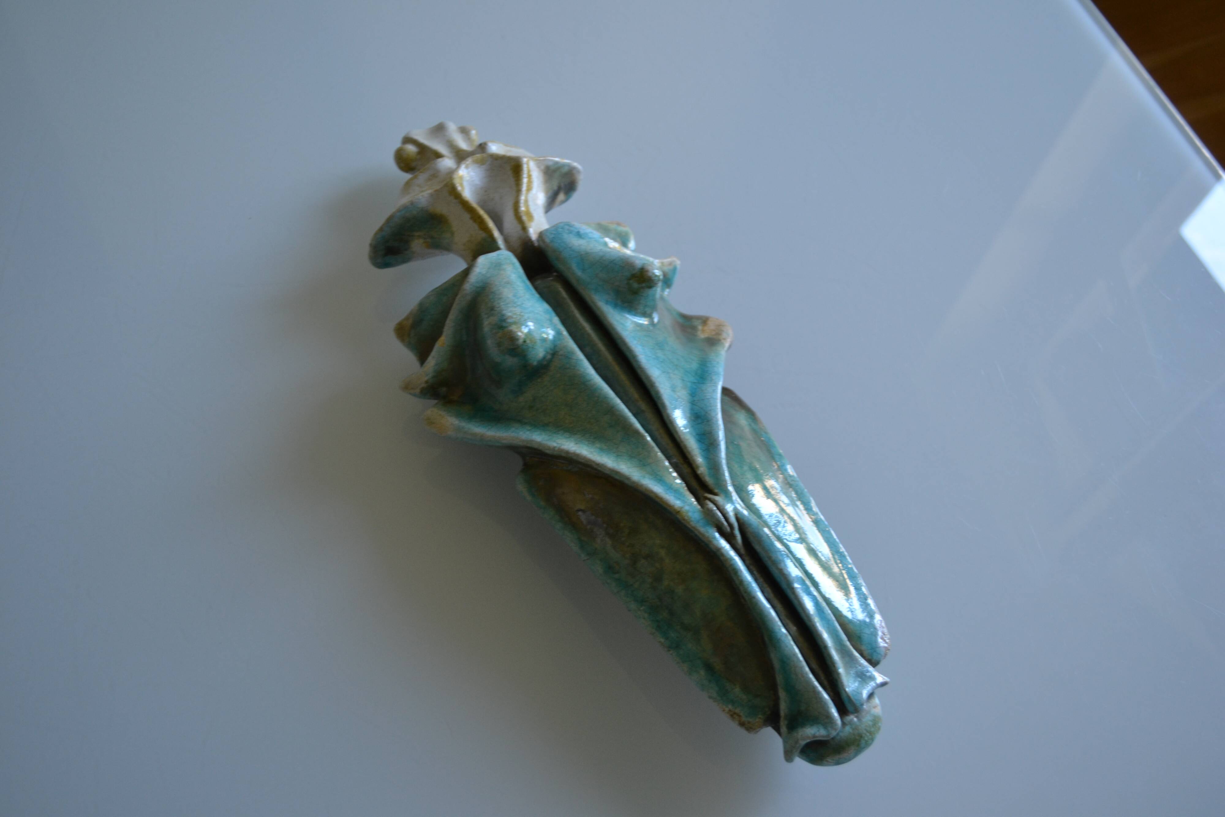 Surreal ceramic sculpture in relief signed to be identified.