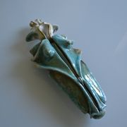 Surreal ceramic sculpture in relief signed to be identified.