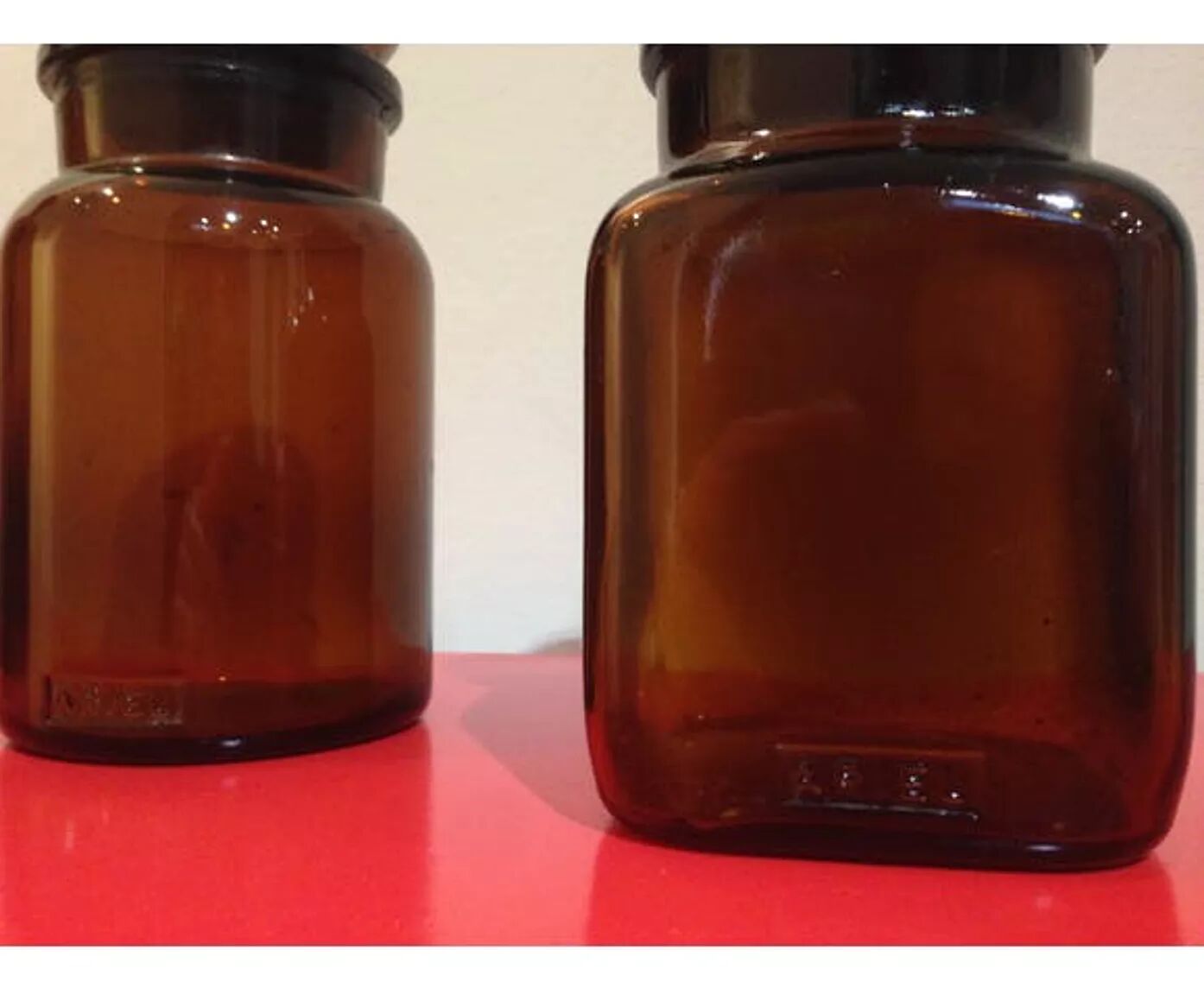 Pair of old amber glass jars