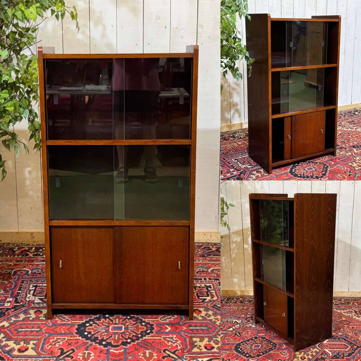 Small English oak library from the 1960s with sliding doors.