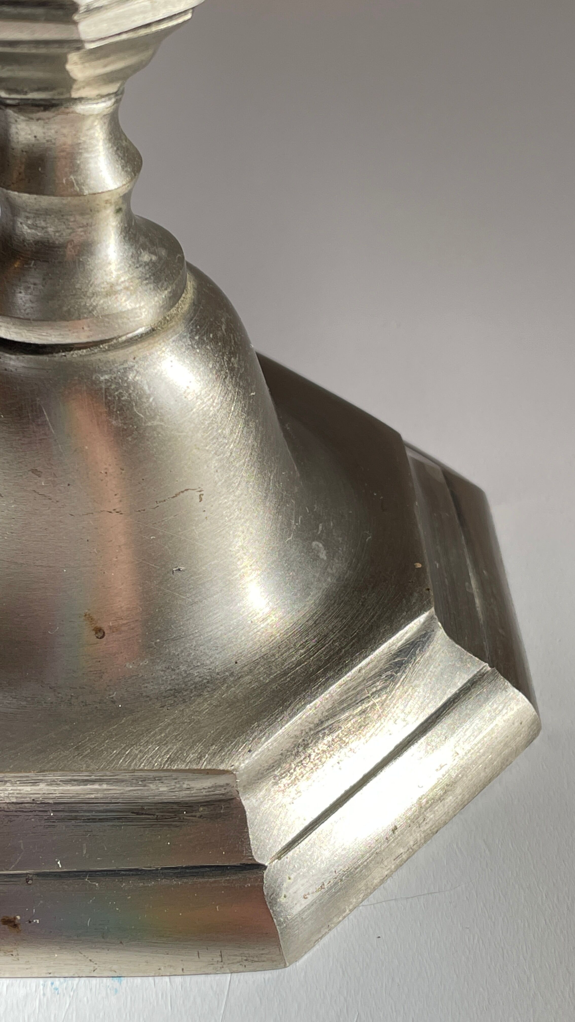 Steel candlestick lamp and grey velvet