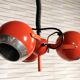 Suspended eyeballs, space age, bright orange, vintage, 70s