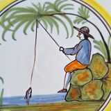 Earthenware plate with fisherman decoration