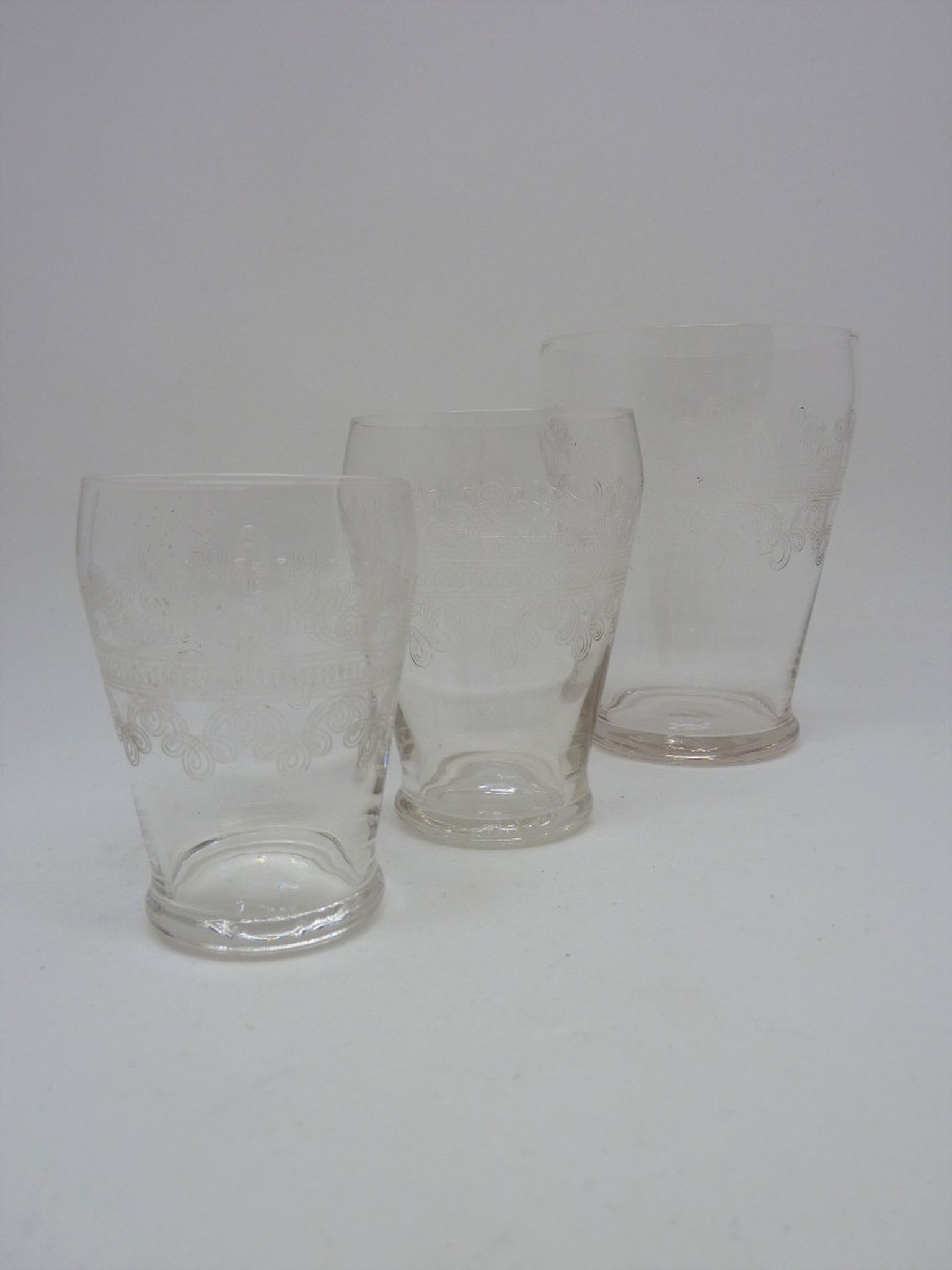 32 antique glasses engraved with Friezes of Arabic and spirals