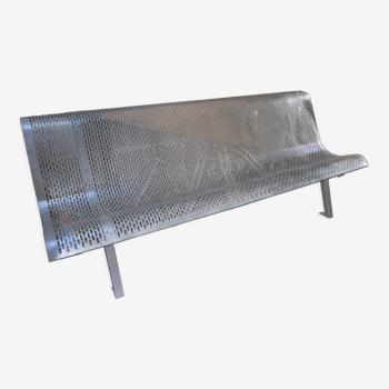 Metal bench perforated outside garden