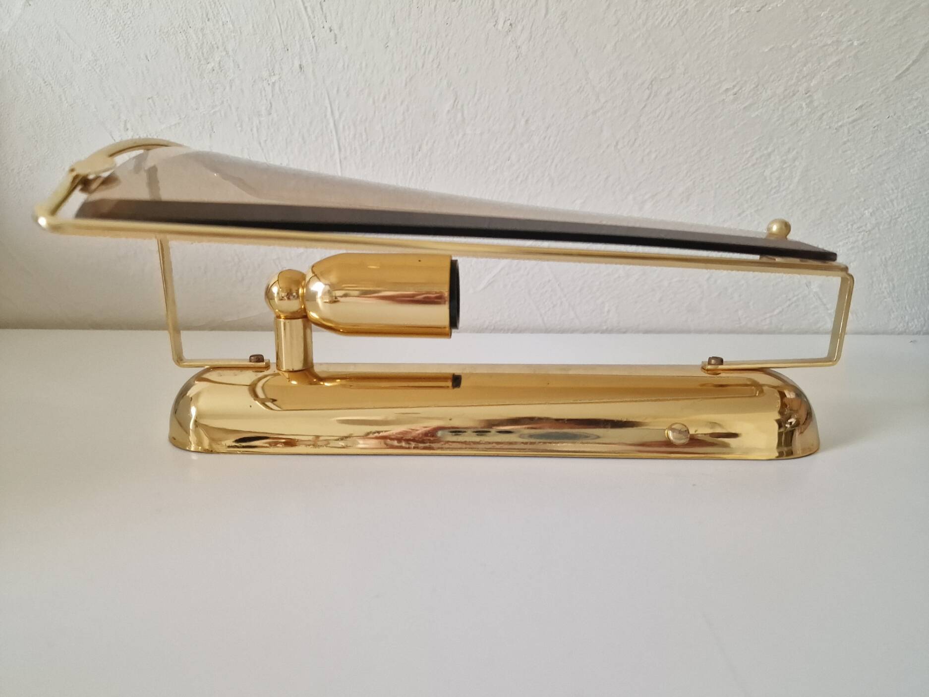Pair of wall lights in brass and smoked glass by Lakro Amstelveen.