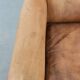 Vintage sheepskin armchair with a beautiful light colour and elegant legs