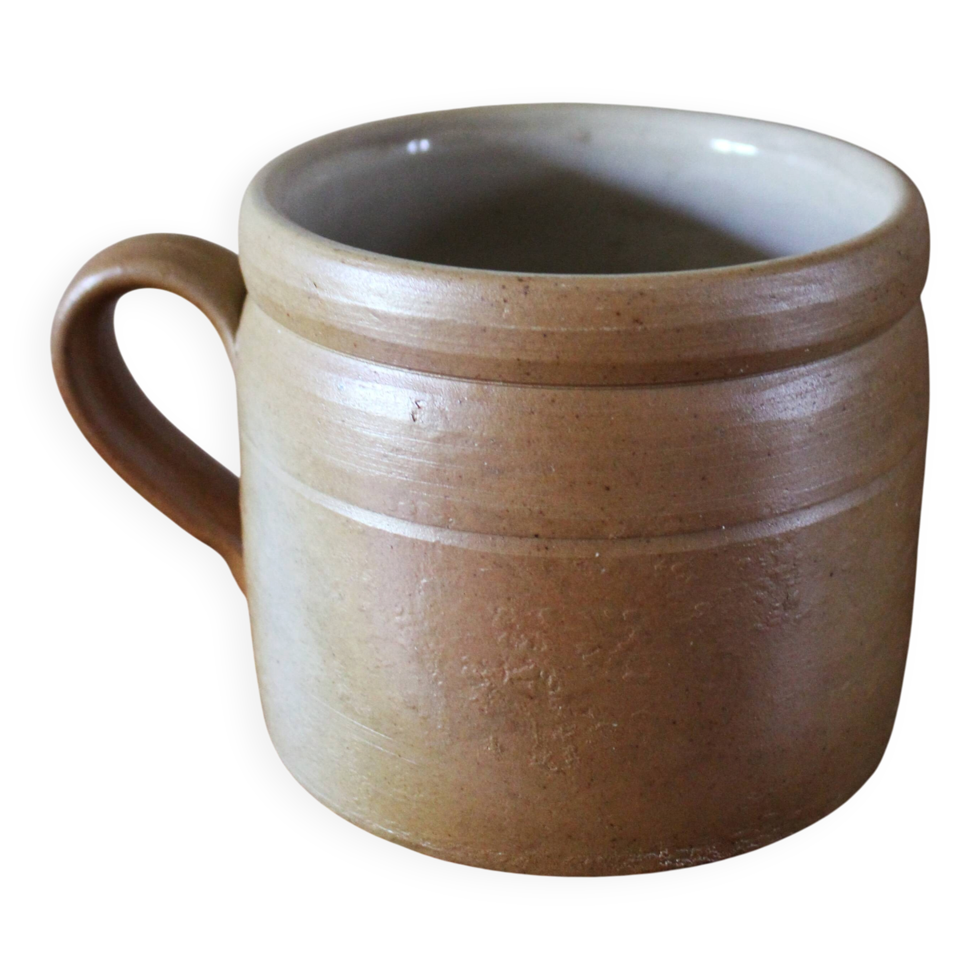 Vase terracotta milk jug with a glazed interior handle.