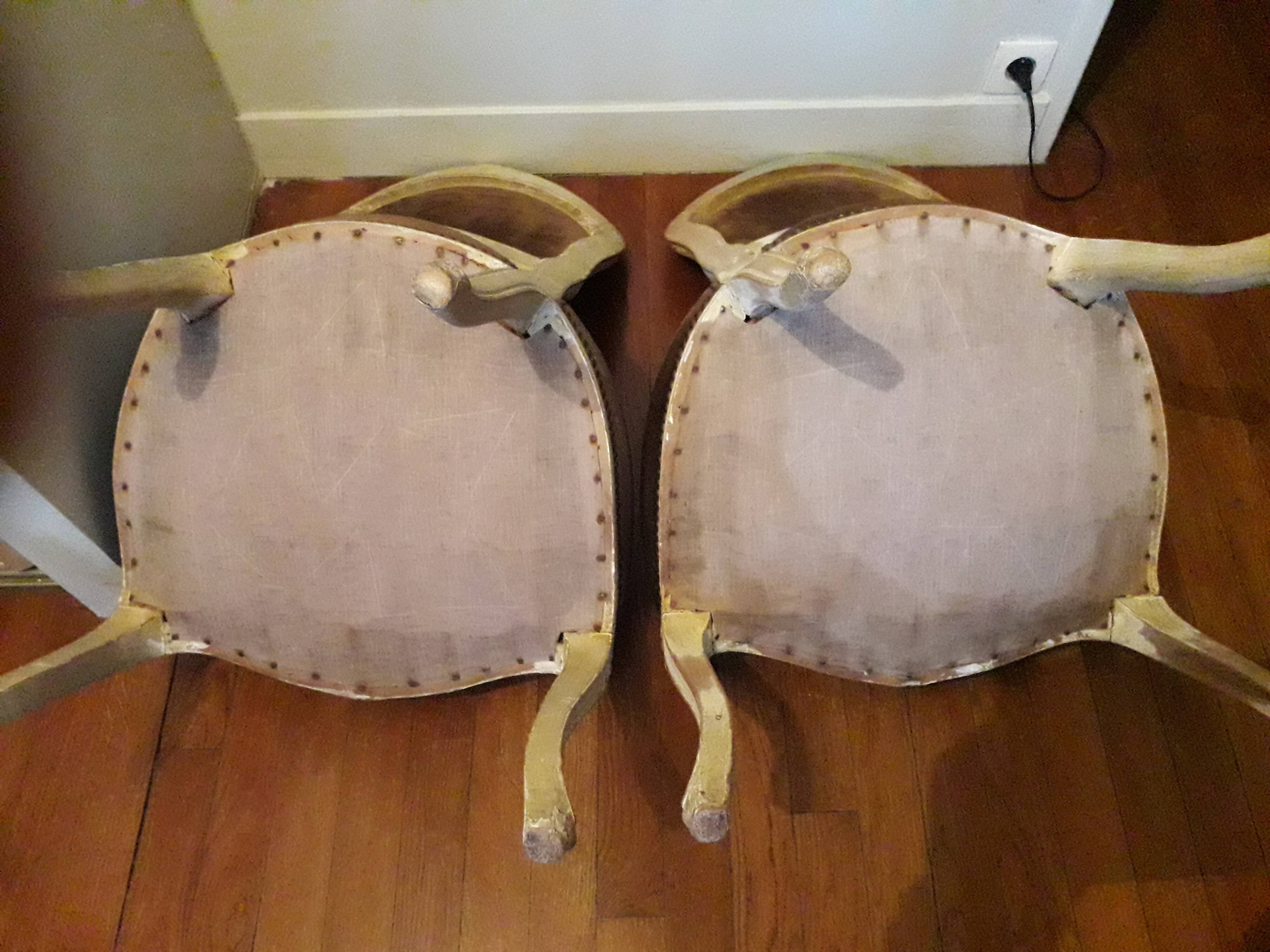 A pair of Louis XV style armchairs in wood and velvet fabrics