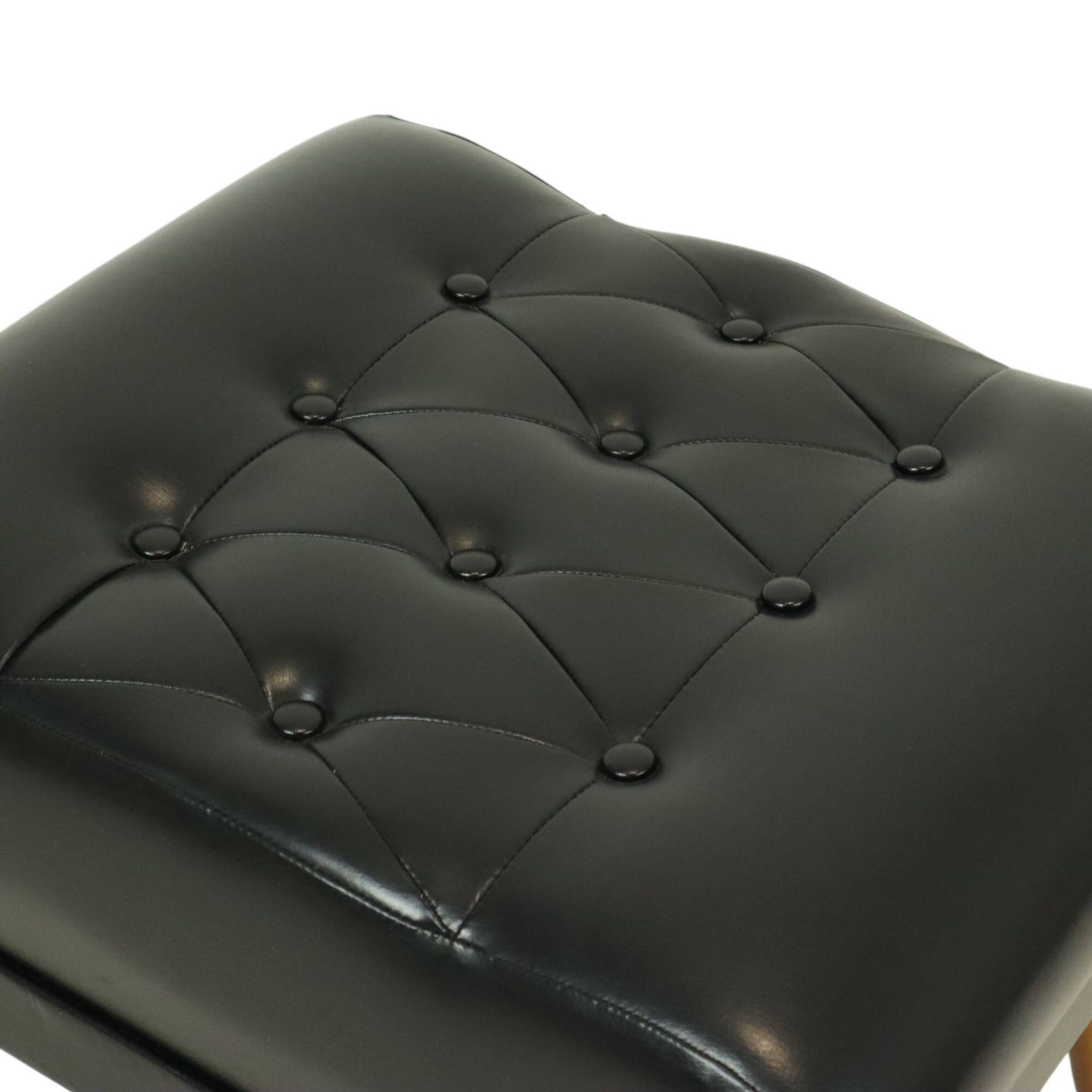 Pouf noir vintage pieds coniques style Chesterfield en skaï